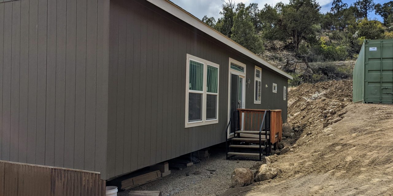 How do I find out the age and manufacture of a manufactured home?